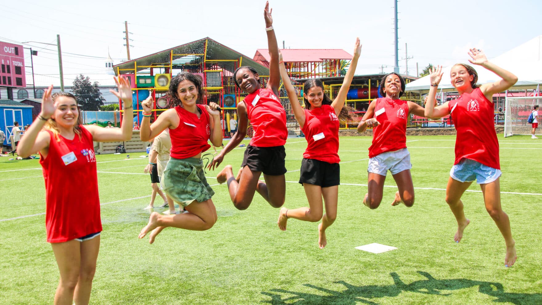 CIT campers jumping in the air.