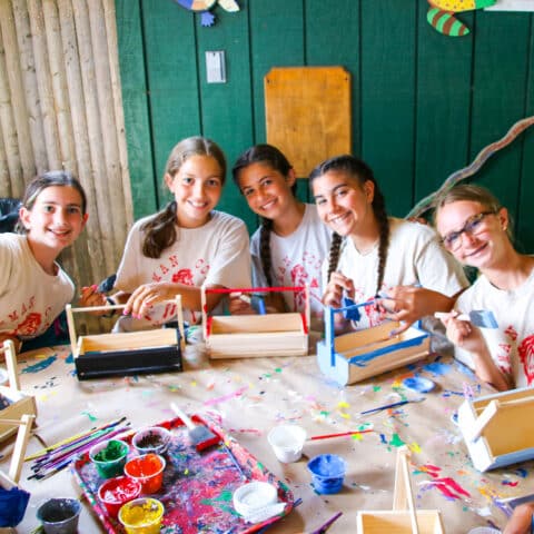 Campers doing crafts together.