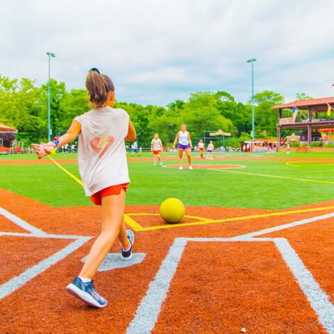 Explorers camper prepares to kick ball