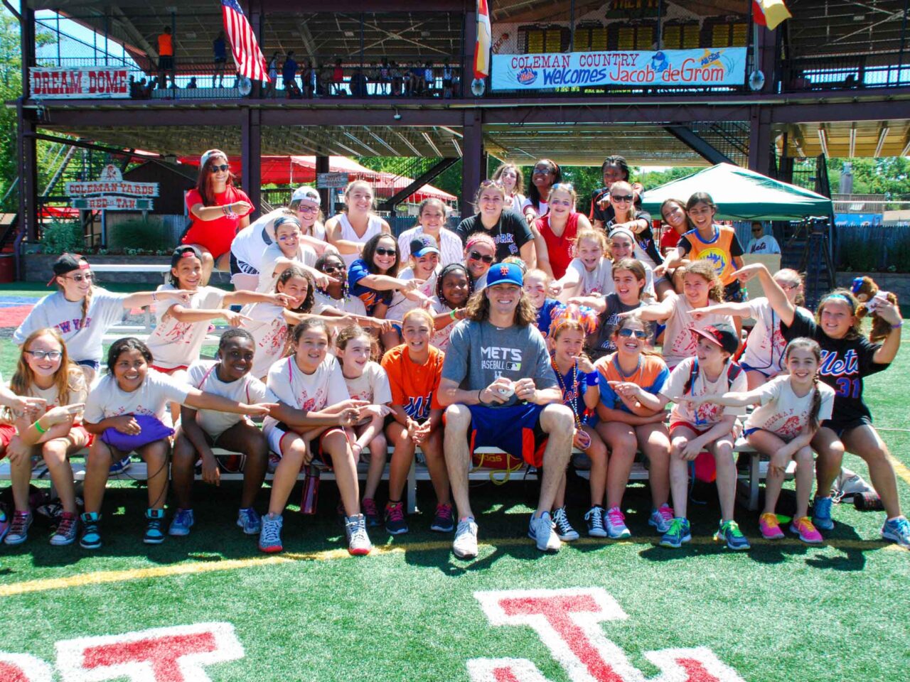 Group of campers point toward Jacob deGrom