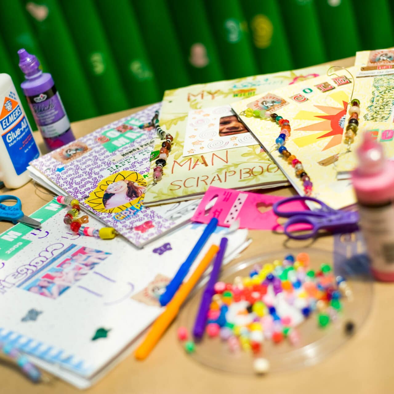 Table full of arts and crafts supplies.