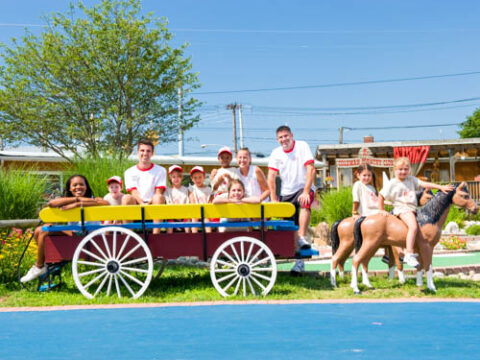 Campers sitting in a wagon.